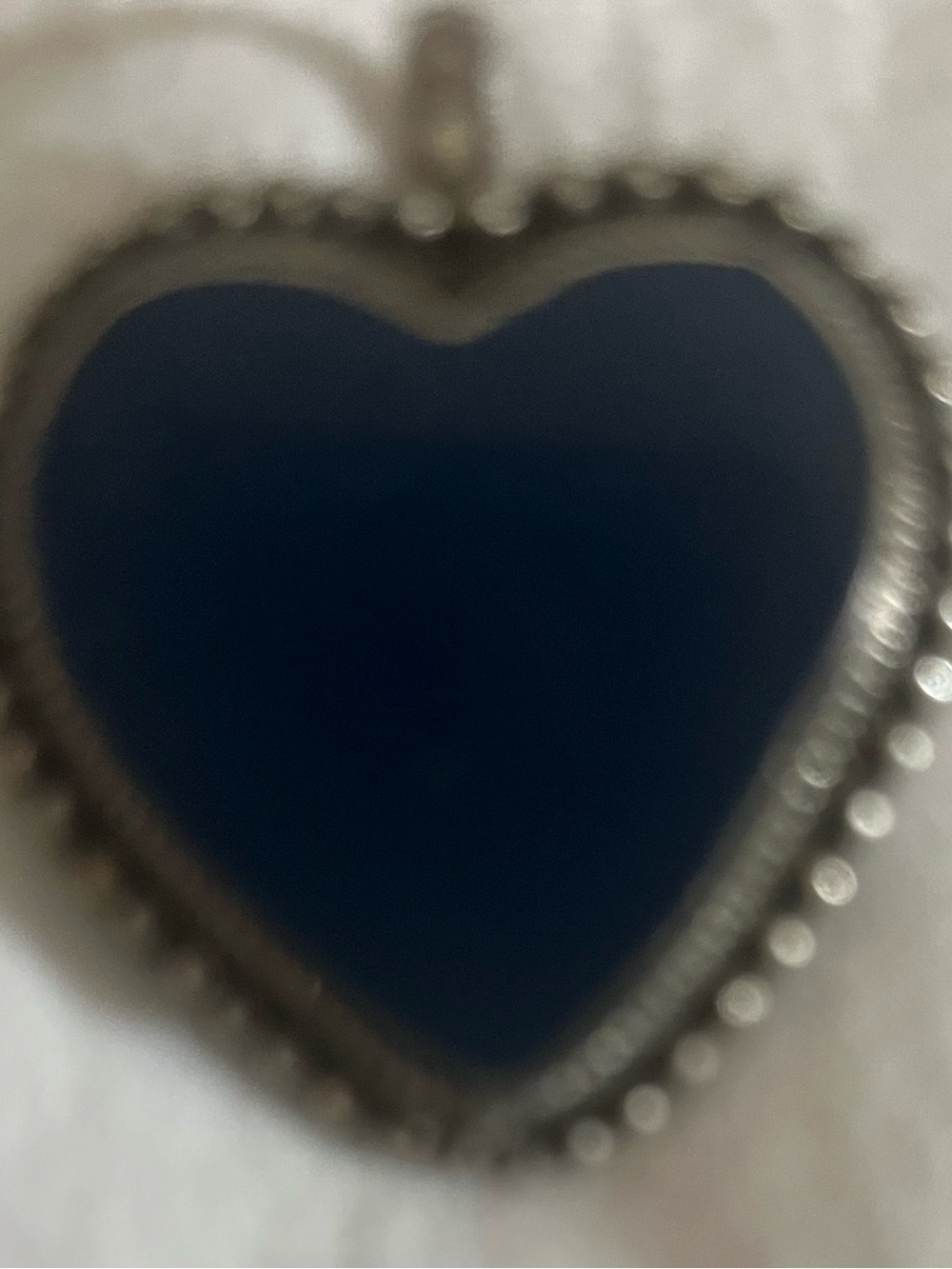 Heart Pendant in Deep Navy It is not silver. You can attach the charm to necklac
